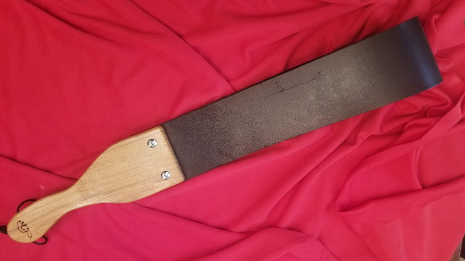 Ergonomic handle with leather strap